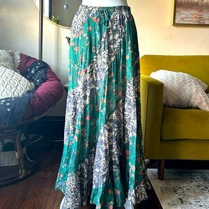 Free people long skirt. Colors green, cream, brown and orange. Size small.